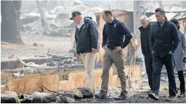 ?? PAUL KITAGAKI JR./THE SACRAMENTO BEE VIA AP ?? President Trump and other officials tour a mobile home and RV park in Paradise, Calif.