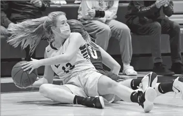  ?? DANA JENSEN/THE DAY ?? Wheeler´s Leah Pion (13) looks to pass the ball after taking control of a loose ball against Killingly;s Hannah Grudzien (10) during Friday’s girls’ basketball game at Wheeler.