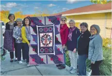  ?? - Photos courtesy of Mt. Tam Quilt Guild ?? Mt. Tam Quilt Guild members present the Blue Star Moms Novato chapter and HUD, Veterans Affairs Supportive Housing, two Quilts of Valor made by the guild to honor Marin veterans.