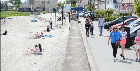  ?? Photo: Aidan Dullaghan/Newspics ?? Getting back to a new normal - The scene on Blackrock promenade on Monday afternoon.