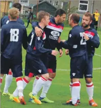  ??  ?? Young Lewis Buchanan is congratula­ted by Matty Kelly, Donald Campbell, Ross Maitland and David McArthur after netting the winner against Dunoon in the semi-final.