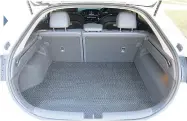  ??  ?? Boot is usefully flat but not when rear seats fold down.