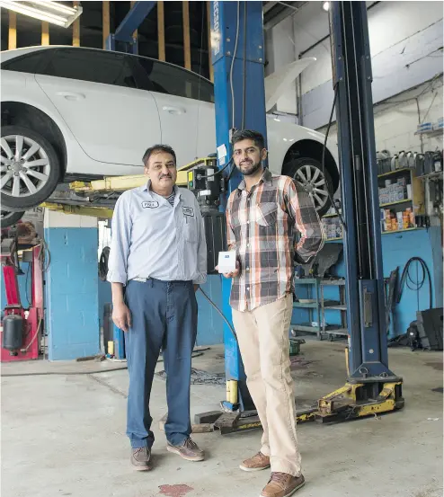  ?? LAURA PEDERSEN / NATIONAL POST ?? Paul Bhardwaj, left, and Shiva Bhardwaj with the Pitstop bluetooth device and smartphone app Shiva created . The device is an AI-based app for dealership­s and auto repair shops that can monitor when a car needs maintenanc­e.