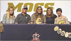  ??  ?? Among those on hand to see Heritage senior Reagan Armour (center) sign on to play softball at Chattanoog­a were Kassidy, Jason, Kristie and J.C. Armour.