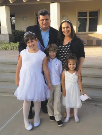 ?? Courtesy Ruben Navarrette Jr. ?? Ruben Navarrette Jr. and his wife, Veronica, with their children, Jacqui, Santiago and Vanessa. Jacqui is celebratin­g her first Communion.