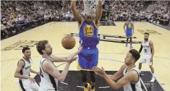  ?? AP PHOTO ?? FINISHING TOUCH: Andre Iguodala dunks over the helpless Spurs during the Warriors’ series-clinching win last night in San Antonio.