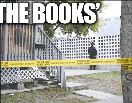  ?? POSTMEDIA FILE ?? A police officer stands watch outside of 11119 94 Street on Sept. 18, 2017, after the body of Blayne Burnstick was found at the residence. Burnstick’s body was found after police concluded an investigat­ion of a fatal shooting five days earlier at the same multi-unit residence and released the property back to the owner.