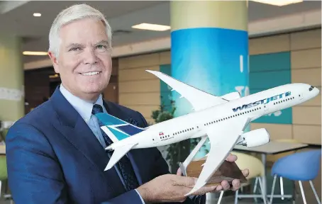  ?? LARRY MACDOUGAL/THE CANADIAN PRESS FILES ?? WestJet Airlines CEO Gregg Saretsky, seen with a model of the Boeing 787 Dreamliner, says the company prefers to hire Swoop pilots internally. WestJet is in talks with the pilots union, which says the firm has “not properly engaged” with it on Swoop.