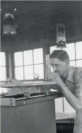  ??  ?? Roy Sullivan takes measuremen­ts in a Shenandoah National Park fire lookout tower.