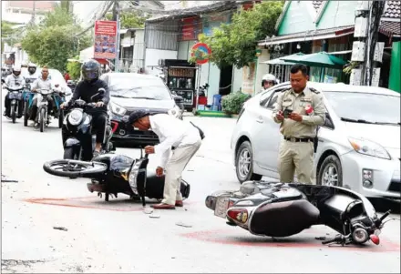  ?? HENG CHIVOAN ?? The aftermath of a road accident involving two motorcycle­s in the capital’s Sen Sok district last June.