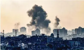  ?? Ronaldo Schemidt/AFP/Getty Images ?? Smoke over the northern Gaza Strip following an Israeli strike in October. Photograph: