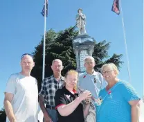  ?? PHOTO: SIMON HENDERSON ?? Not forgotten . . . Alexandra residents (from left) Mark Davies, Jim Kennedy, Christine Wright, Tom Woodford and Jude Parbhu take a moment to remember the fallen at Alexandra War Memorial yesterday.