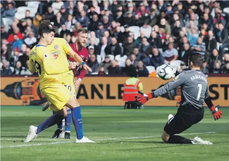  ?? AP ?? Chelsea striker Alvaro Morata, left, sees his shot blocked by West Ham goalkeeper Lukasz Fabianski at the London Stadium yesterday, in a match where neither side created many goalscorin­g opportunit­ies