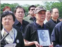  ?? PROVIDED TO CHINA DAILY ?? Zhang Yajie (left) and other relatives of Kuomintang soldiers attend a memorial at the Taiwan Martyrs’ Shrine in Taipei.