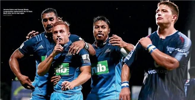  ?? PHOTOSPORT ?? Jerome Kaino and George Moala congratula­te replacemen­t No 10 Ihaia West after his try last night.