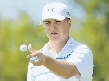  ?? AP PHOTOS ?? TOP OF THE HEAP: Jordan Spieth (above) may be the hottest player on the planet, with two majors this year and a close call at the British Open, but a smiling Rory McIlroy (below) is fully committed to taking back that crown he wore last year.