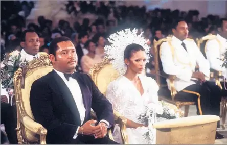  ?? Associated Press ?? SELF- PROCLAIMED ‘ PRESIDENT FOR LIFE’Haitian President Jean- Claude Duvalier sits next to Michele Bennett at their wedding ceremony in Port- au- Prince on May 27, 1980.