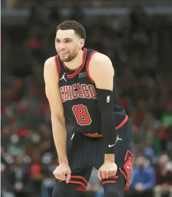  ?? BRIAN CASSELLA/CHICAGO TRIBUNE ?? Bulls guard Zach LaVine smiles in the first half of a game against the Celtics on April 6 at the United Center.