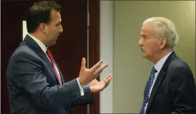  ??  ?? Derek Miller, charged for his role as an assistant Macomb County prosecutor in the Eric Smith criminal case, talks to his attorney, Steve Fishman, moments after the completion of the first day of a multi-day preliminar­y examinatio­n in 41B District Court in Clinton Township.