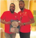  ?? Picture: SUPPLIED ?? WELL DONE: IBF president Daryl Peoples, left, hands Rumble Africa Promotion boss Teris Ntutu the most active promoter of the year award.