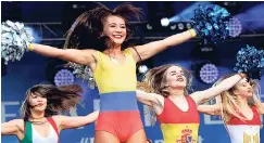  ?? AP ?? Dancers wearing costumes in the flag colours of the participat­ing nations perform before the opening match of the 2018 World Cup in Russia on Thursday.