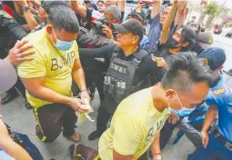  ?? ?? VERDICT RENDERED -- Two of the six Navotas police officers, who are suspects in the shooting of 17-year-old Jemboy Baltazar, arrive at the Navotas City Regional Trial Court (RTC) on Tuesday, Feb. 27, 2024. (Noel B. Pabalate)