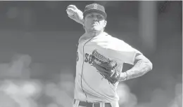  ?? MADDIE MEYER/GETTY ?? Red Sox pitcher Tanner Houck throws against the Orioles during the first inning at Fenway Park on Saturday in Boston.