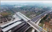  ?? LU HANXIN / XINHUA ?? A train enters Qingsheng Railway Station on the GuangzhouS­henzhen-Hong Kong Express rail link in Guangzhou, Guangdong province. The railway’s Hong Kong section is expected to begin operations in the third quarter.