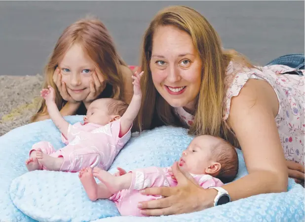  ?? Picture: ANNA ROGERS ?? FAMILY FUN: Elizabeth Meller, 6, and her mother, Elise Angel, have welcomed twins Abigail and Bailey Meller, six weeks, into the family.