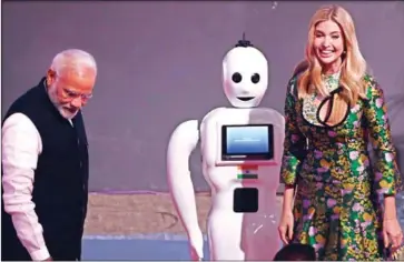  ?? MONEY SHARMA/AFP ?? Indian Prime Minister Narendra Modi and Ivanka Trump look on after formally inaugurati­ng the Global Entreprene­urship Summmit in Hyderabad on Tuesday.