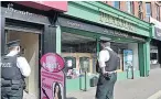  ??  ?? SCENE Police at West Belfast pharmacy