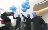  ?? PROVIDED TO CHINA DAILY ?? Blue men entertain fans with balloons during a promotiona­l event in the Guangzhou Opera House.