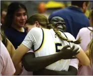  ?? BRENT W. NEW — BOCOPREPS.COM ?? Frederick’s Gabby Jima and Izzy Howard share an embrace following a win over Skyline Thursday.