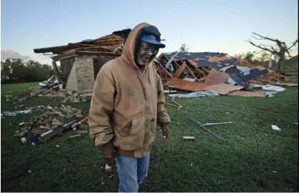  ?? Photograph: LM Otero/AP ?? Willie Meeds walks from a relative's home on 5 November 2022 after a tornado struck in Powderly, Texas.