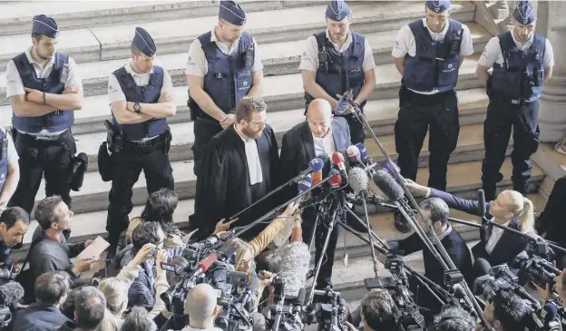  ?? PICTURE: THIERRY ROGE ?? 0 Sven Mary and Romain Delcoigne, the Belgian lawyers representi­ng Paris attacks prime suspect Salah Abdeslam, speak outside the court