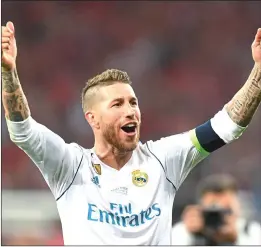  ??  ?? CAPTAIN FANTASTIC: Sergio Ramos celebrates his third successive Champions League trophy but was also at the centre of much controvers­y