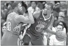  ?? AP/MICHAEL WYKE ?? Kevin Durant (right) of the Golden State Warriors said he was targeted by NBA referee James Williams when he was ejected Tuesday night. “I’m sure when I see James again, I’m sure he’ll still be in his feelings,” Durant said.