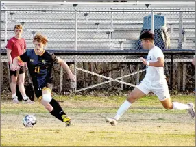  ?? MARK HUMPHREY ENTERPRISE-LEADER ?? Prairie Grove's Paytin Higgins maneuvers the ball against Berryville. A spirited Tiger boys soccer squad competed well against a Bobcat team expected to overpower them during a 3-1 conference loss at home to the Bobcats on Tuesday, April 5, 2022.