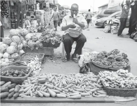  ?? PHOTO: ONYEKACHUK­WU OBI ?? Haruna Suleiman waits for customers at Utako Market in Abuja.