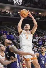  ?? Stacy Revere/Getty Images ?? Dylan Disu (1) scored a career-high 28 points to lead Texas to a win Saturday night over Penn State.