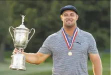  ?? Gregory Shamus / Getty Images ?? After adding 50 pounds to his frame in the past year, Bryson DeChambeau won the U.S. Open at Winged Foot by six shots.