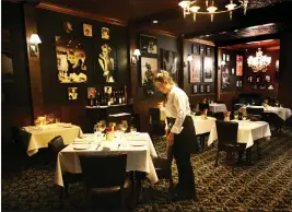  ?? PHOTOS BY SHERRY LAVARS — MARIN INDEPENDEN­T JOURNAL ?? The dining room at the Board Room and Speakeasy harkens back to a different era.