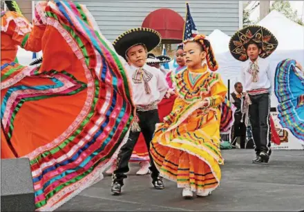  ?? CHRIS BARBER — DIGITAL FIRST MEDIA ?? Children perform the Mexican Hat Dance at Kennett Square’s Cinco De Mayo celebratio­n.