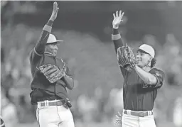  ?? JAYNE KAMIN-ONCEA/USA TODAY SPORTS ?? The Diamondbac­ks’ Alek Thomas, right, celebrates with Geraldo Perdomo after a win over the Rockies on Sunday.