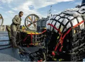  ?? ASSOCIATED PRESS ?? Navy sailors prepare material recovered off the coast of South Carolina from the shooting down of a Chinese high-altitude spy balloon.