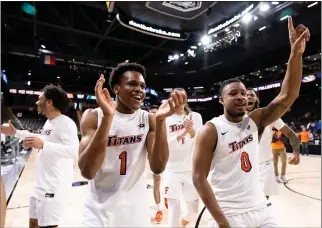  ?? PHOTO BY TRE PENN – BIG WEST CONFERENCE ?? Cal State Fullerton guards Jalen Harris, left, and Daeshawn Eaton celebrate their win over Hawaii on Thursday.