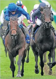  ??  ?? William Buick (left) rides Pinatubo to win the Darley Dewhurst Stakes at Newmarket yesterday