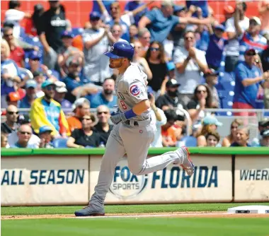  ?? AP ?? The Cubs’ Ian Happ became the first player since Dwight Evans in 1986 to hit the first pitch of the season for a home run.