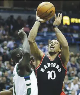  ?? Ap photo ?? Toronto’s DeMar DeRozan shoots over Milwaukee’s Thon Maker during Game 4 on Saturday.