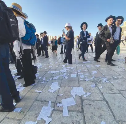  ?? (Courtesy of Women of the Wall) ?? ON JUNE 11, at the Western Wall, 39 Women of the Wall prayer books were grabbed, torn up, and destroyed.